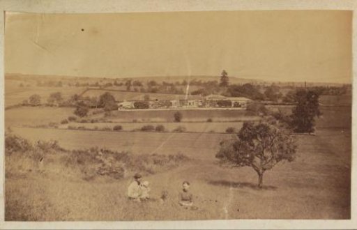 Landscape in France with a Group Sitting in the Grass in the Foreground