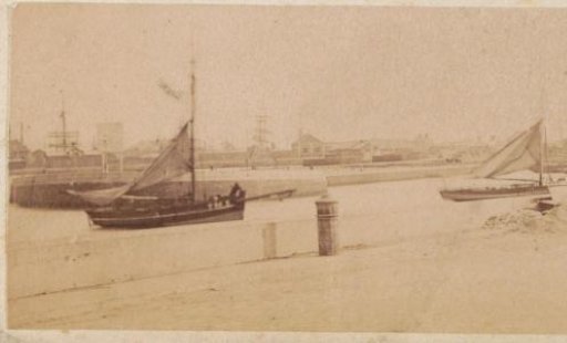 View of a harbor quay and sailing ships in France