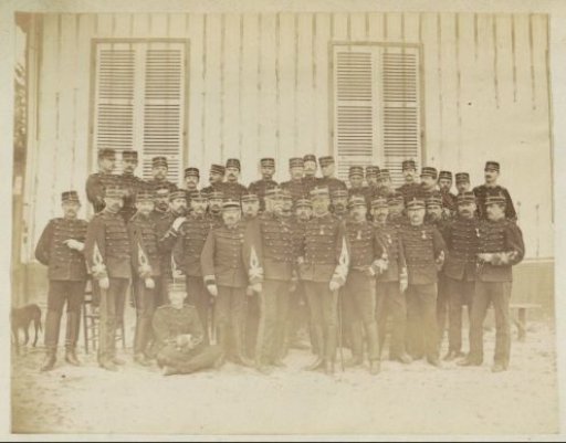 Group portrait of French soldiers standing in front of a building