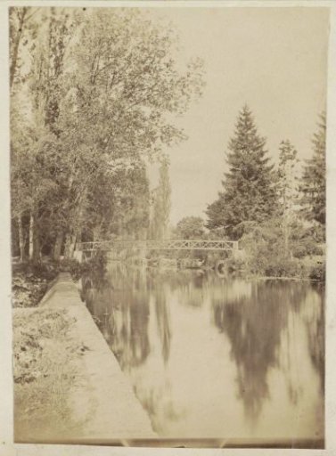 View of a waterway with a footbridge in France