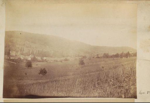 Rolling landscape with fields and a village in France