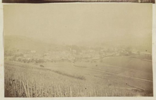 Rolling landscape with fields and a village in France