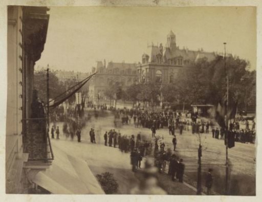 Street scene in Le Havre with a crowd at the town hall