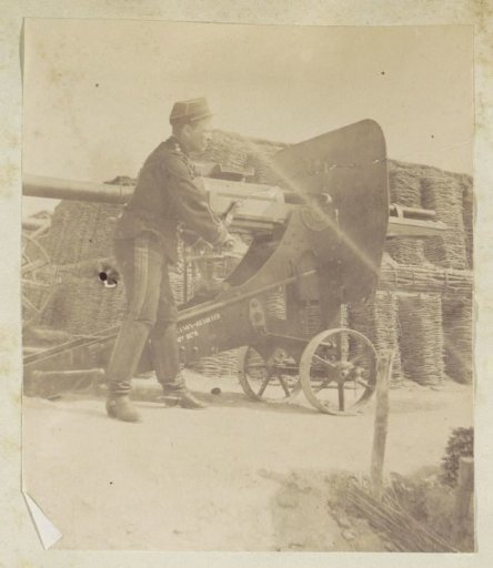 French soldier with a light cannon inscribed 'canon-revolver 1879'