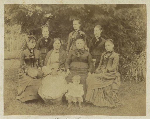 Group portrait of seven Frenchwomen and two children