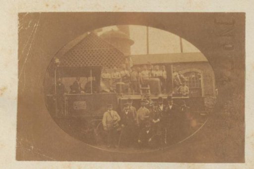 Group Portrait of Railway Staff with a Steam Locomotive, Probably in France