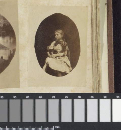 Portrait of a child with a doll