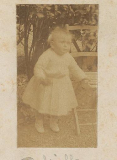 Portrait of a little girl, designated as Gabrielle, standing