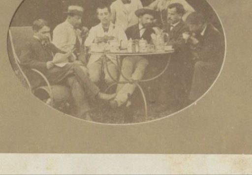 Group portrait of eight Frenchmen around a table