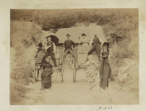 Group posing on farm carts in France