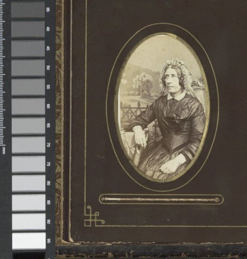 Portrait of a woman with a cap, seated