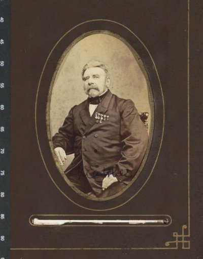 Portrait of Mr. Matthes with medals on his chest, seated