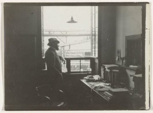 Man Looking Out of a Window