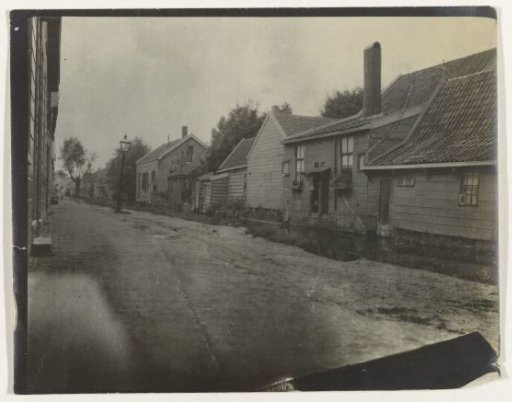 View in a Village Street with Wooden Houses