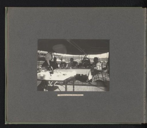 Joseph Harvey Ladew and his party having breakfast on the deck of the Columbia in the harbor of Havana