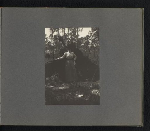 Woman at the roots of a fallen tree
