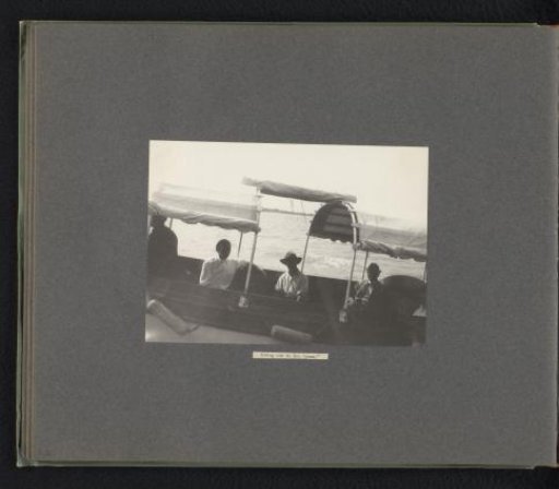 Company in a covered skiff