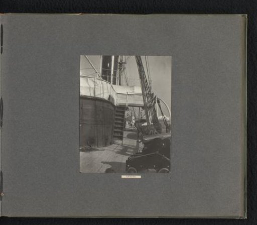Part of the deck of the Columbia, with a smokestack and lifeboats