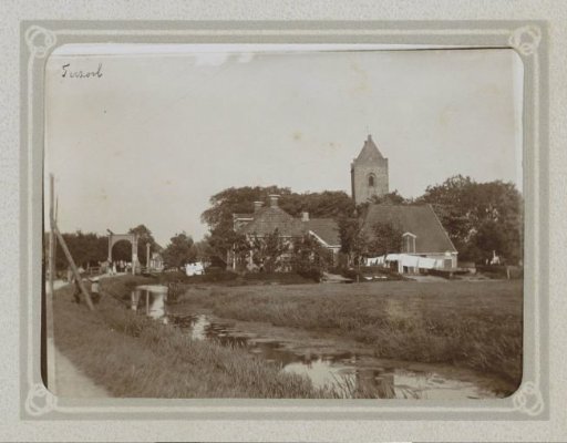View of houses, the church and a bridge over a ditch in Terzool