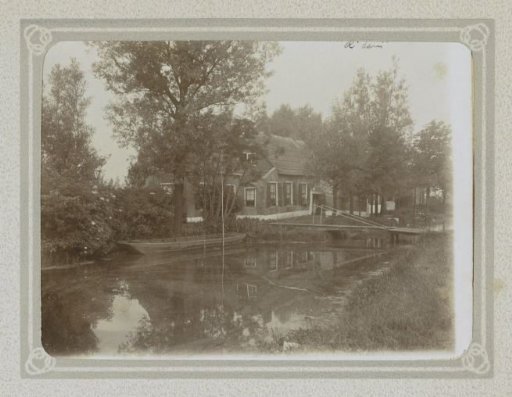 Farmhouse with a bridge over a ditch