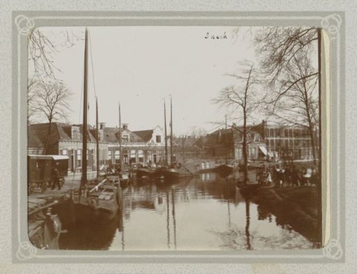 Canal with boats and houses in Sneek