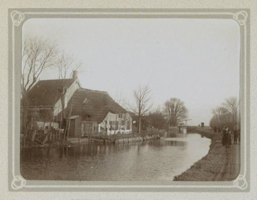 Farm with a View of a Waterway and a Road with People