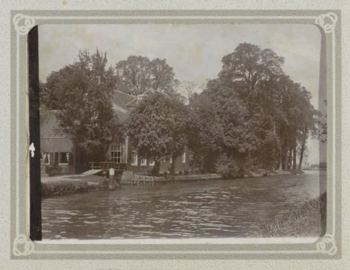 House Among Trees by a Waterway