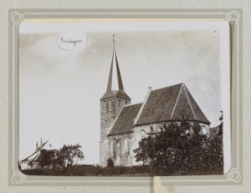Exterior of a church in Persingen with a house next to it