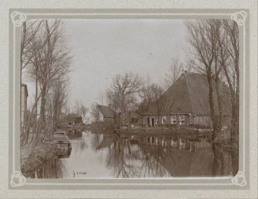 Farmhouses by a waterway in Grouw