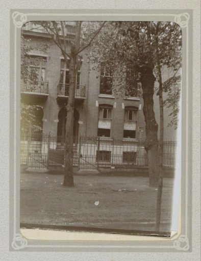 Exterior of a house with trees and a fence