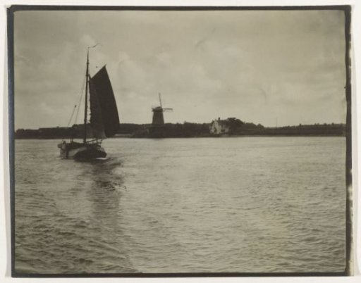 View of a river or the Zuiderzee, with a sailing ship and a windmill, Netherlands