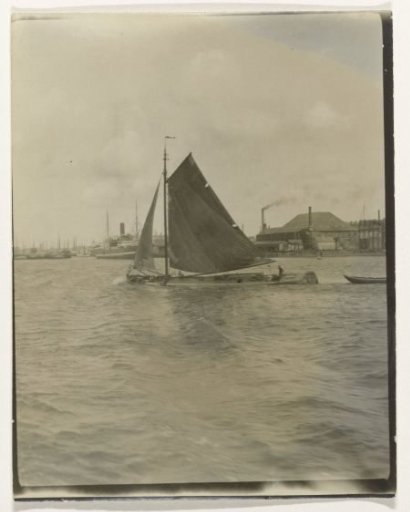 View of a river or canal, Netherlands, with a sailing ship