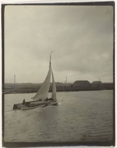 View of a river or canal, Netherlands, with a sailing ship