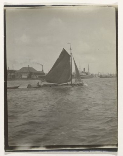 View of a river or canal, Netherlands, with a sailing ship