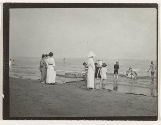 Women and children with kayaks at the sea (North Sea coast), Netherlands or Germany