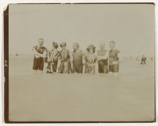 Group portrait of people in the sea (North Sea coast), Netherlands or Germany