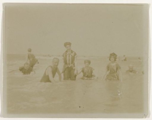 Group portrait of people in the sea (North Sea coast), Netherlands or Germany