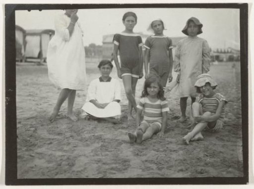 Group portrait of seven children on the beach (North Sea coast), Netherlands or Germany