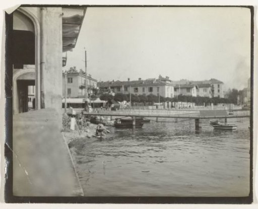 View of a coastal city, with a pier, possibly in Italy