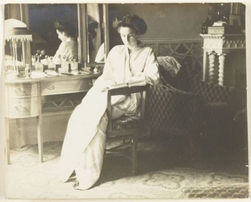 Portrait of an Unknown Woman Seated in Morning Toilette in a Bedroom Interior