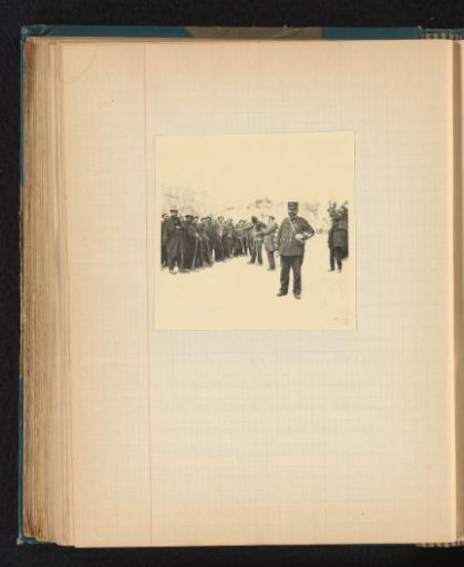 Guard with Arab prisoners lined up