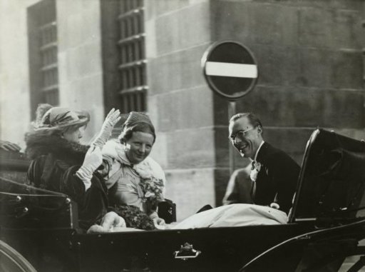Queen Wilhelmina, Princess Juliana, and Prince Bernhard in a Carriage in Front of the Palace on the Dam in Amsterdam