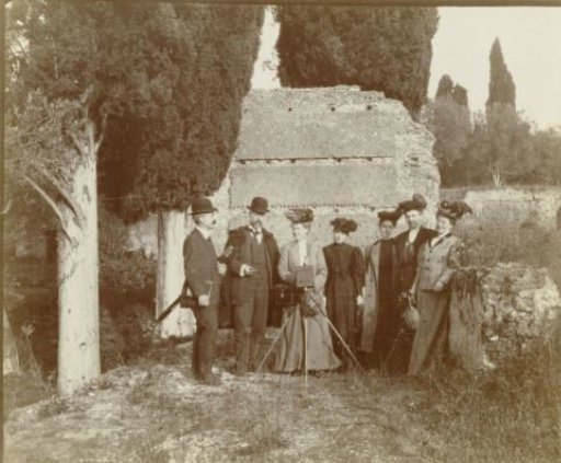 Group Portrait of Five Unknown Women (One Behind a Camera) and Two Men in Front of a Ruin in Italy or France