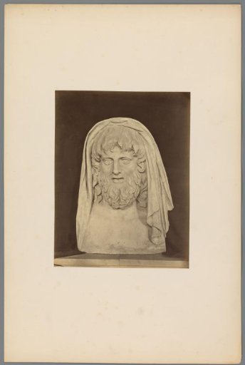 Bust of a man with a beard and a cloth around his head