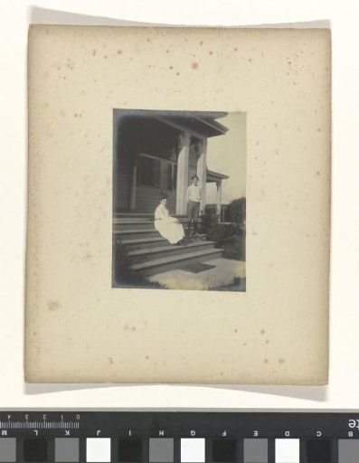 Boy and girl on the steps of a house during the World's Fair in St. Louis (Louisiana Purchase Exposition), 1904