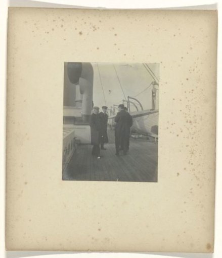 Four men on the deck of a ship
