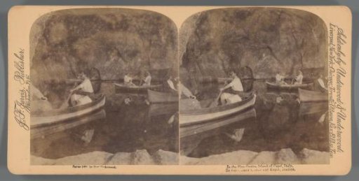 People in rowing boats in the Blue Grotto on Capri, Italy