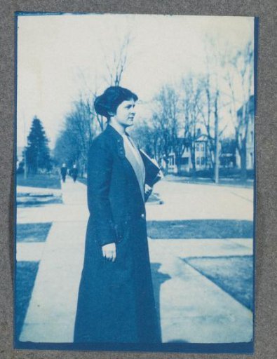 Young student on the street, possibly on the campus of St. Johnsbury Academy in Vermont