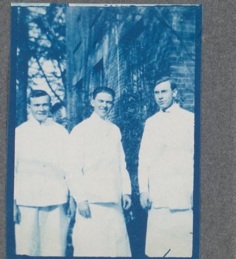 Three students on the street, possibly on the campus of Denison University in Ohio