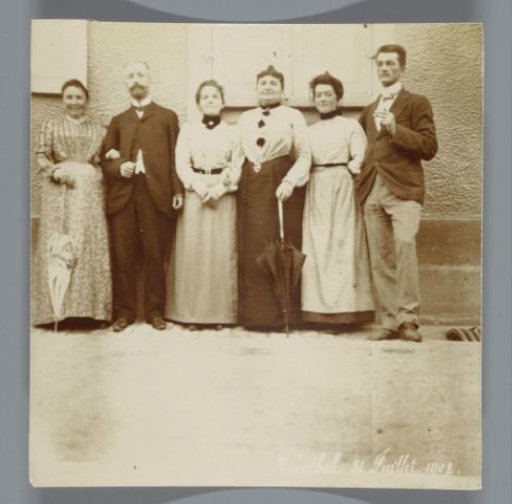 Two men and four women standing in front of a house, Jaegerthal (Bas-Rhin), France